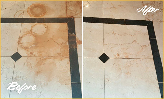 Before and After Picture of a Murray Hard Surface Restoration Service on a Marble Floor to Eliminate Rust Stains